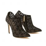 Black suede ankle boots with iconic laser cut pattern, small gold studs and 100 mm stiletto heel