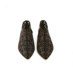 Black suede flat ankle boots with iconic laser cut pattern and small gold studs