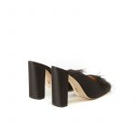 Black satin mules with feathers on the front part and chunky 100 mm heel