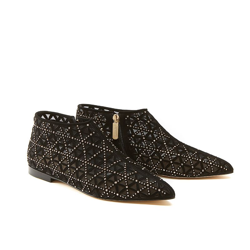 Black suede flat ankle boots with iconic laser cut pattern and small gold studs
