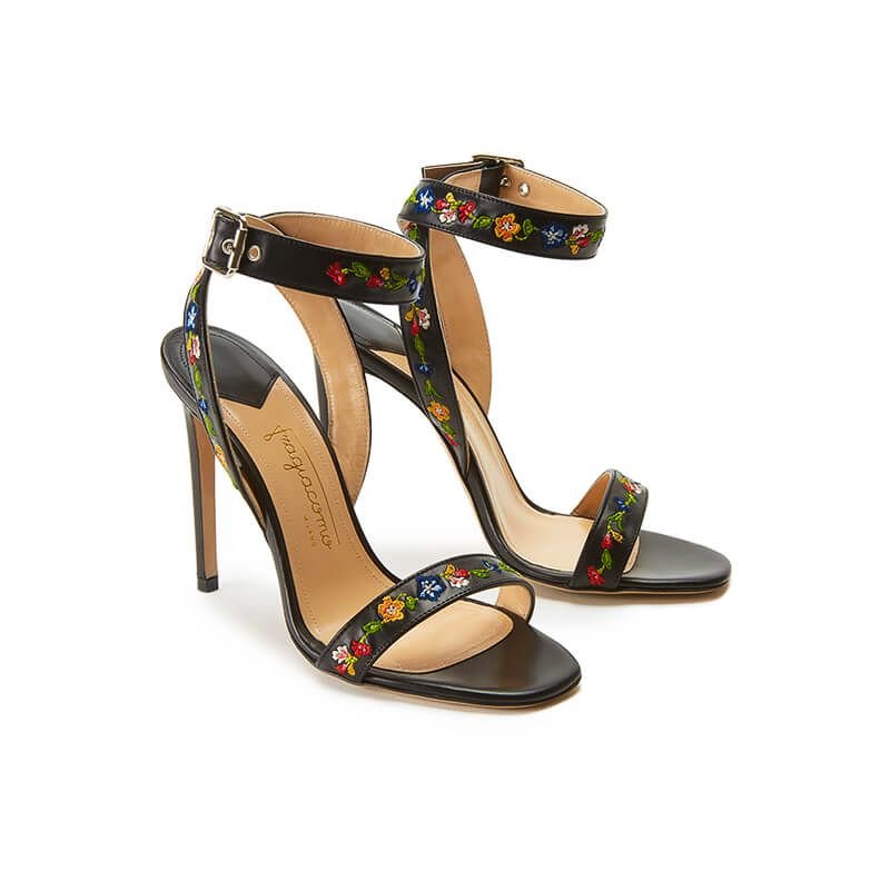 Black leather high heel sandals with embroidered straps, side view
