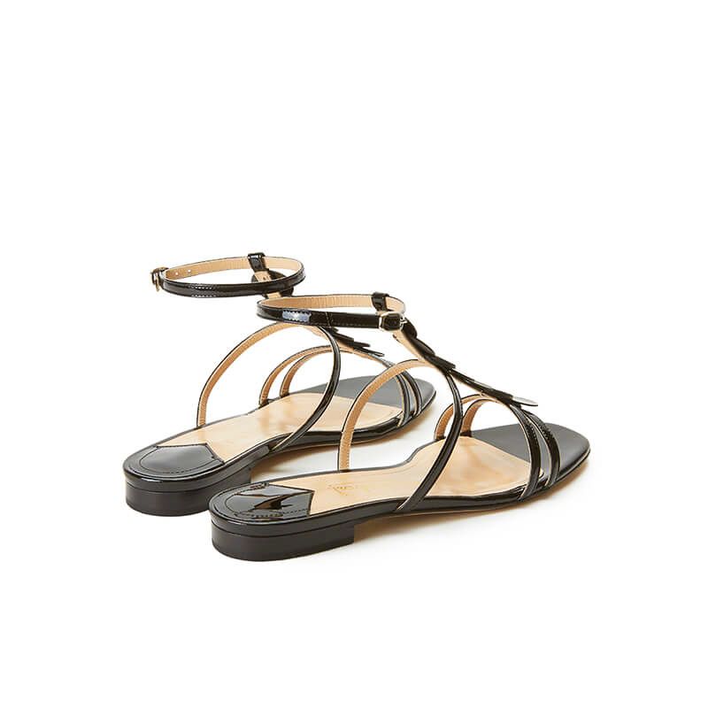 Black patent leather sandals with ankle strap and leather and suede discs, SS19 collection by Fragiacomo, back view
