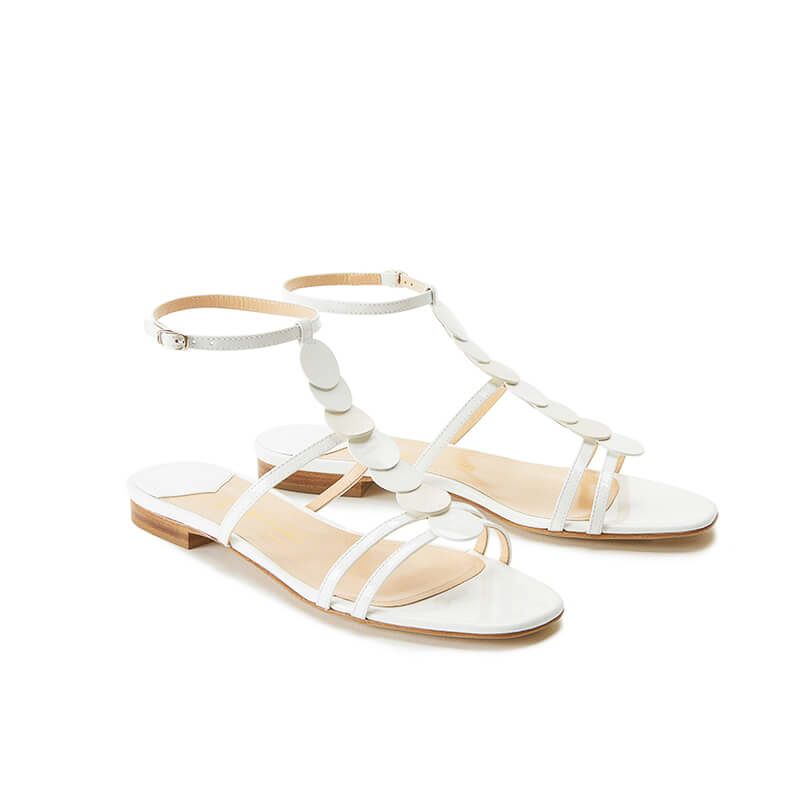 White patent leather sandals with ankle strap and leather and suede discs, SS19 collection by Fragiacomo, side view