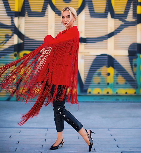 Slingbacks in black and bronze leather from the Flash Capsule Collection worn by Eugenia Polyakova with colorful walls on the background